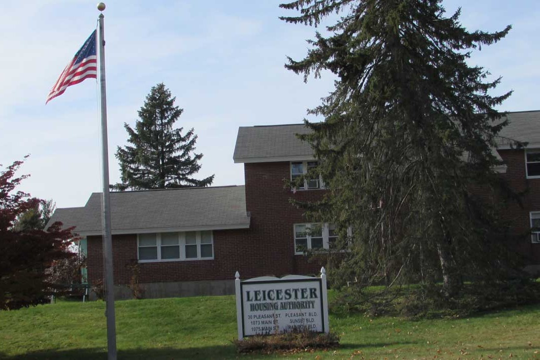 Pleasant Garden building exterior flag pole and sign