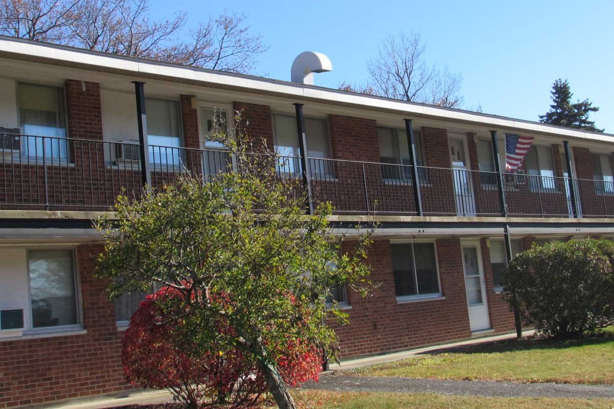 Sunset Gardens property exterior and parking lot